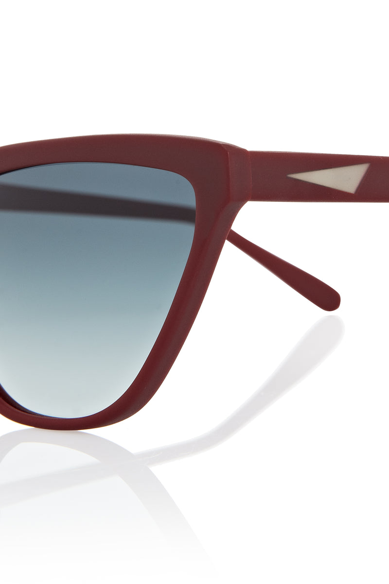 CAIRO - Wine. These frames are a narrow angular shape with a sporty feel to them. They have a near flare top with tapered edges and a flat bottom. These lightweight acetate frames are available in sunglasses and opticals. All acetate frames are exclusively developed for PRISM and handcrafted in Italy.