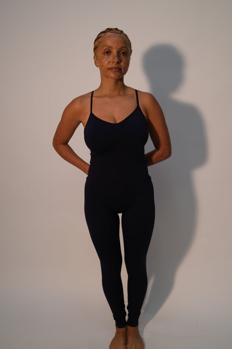 Model wears BALANCED - Black - PRISM² - Womens unitard -  Curvy women playsuit - activewear unitard - black unitard - plus size unitard