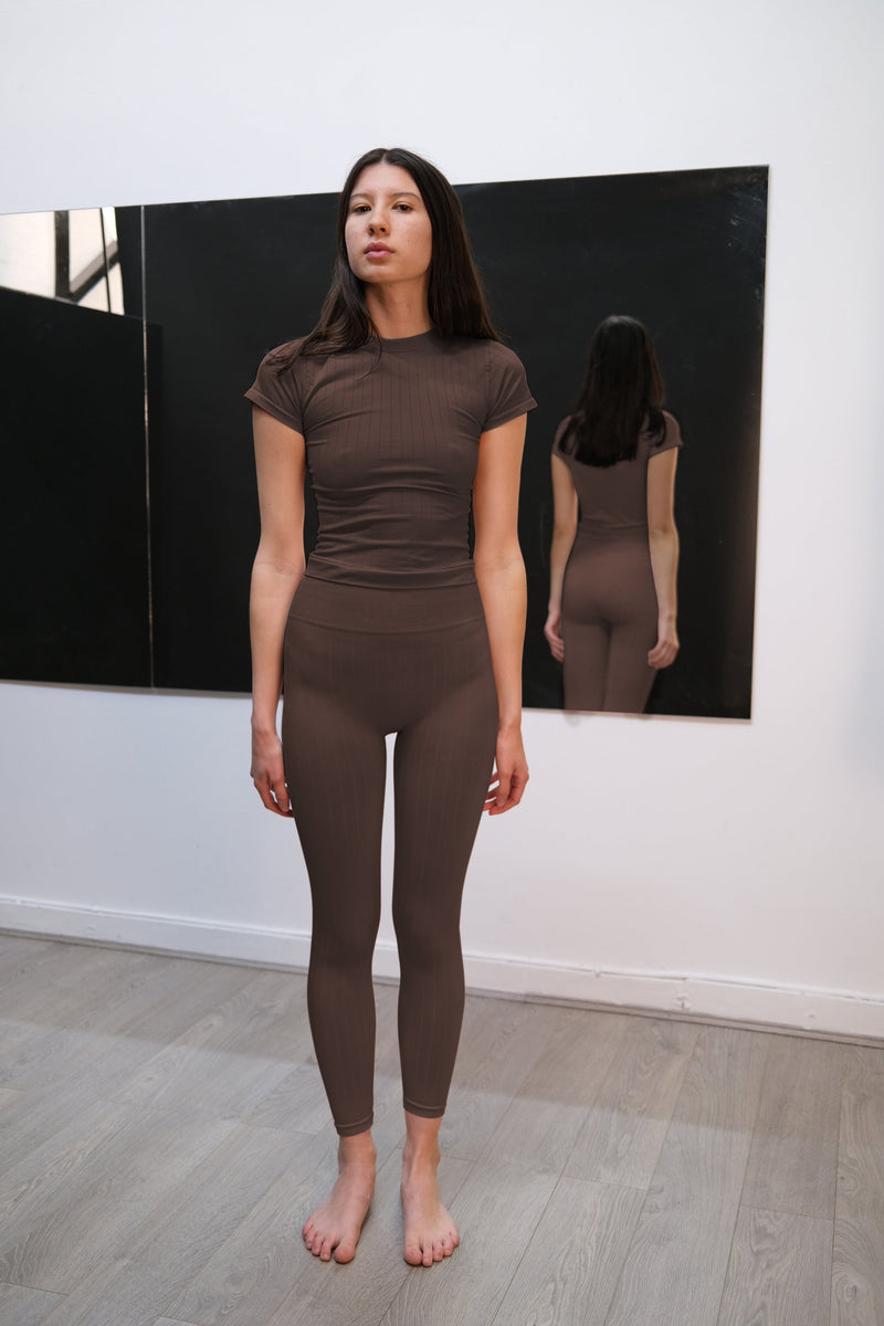 model wears flat ribbed sapient brown compression vest