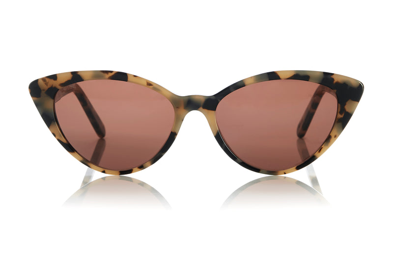 ACCRA - Empathy in cream tortoiseshell. A modern elegant take on the classic cat-eye with rounded edges and elongated tips. Lightweight medium to small sized style, suitable for all face shapes.