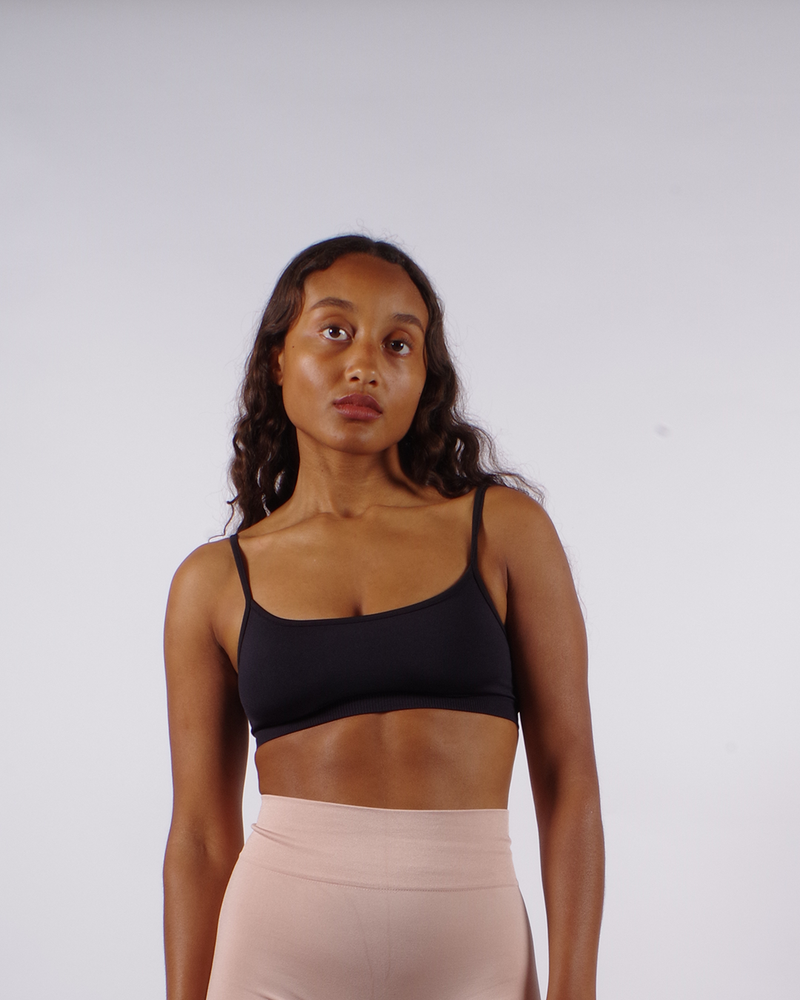 model wears seamless gym black bra top - prism2 london