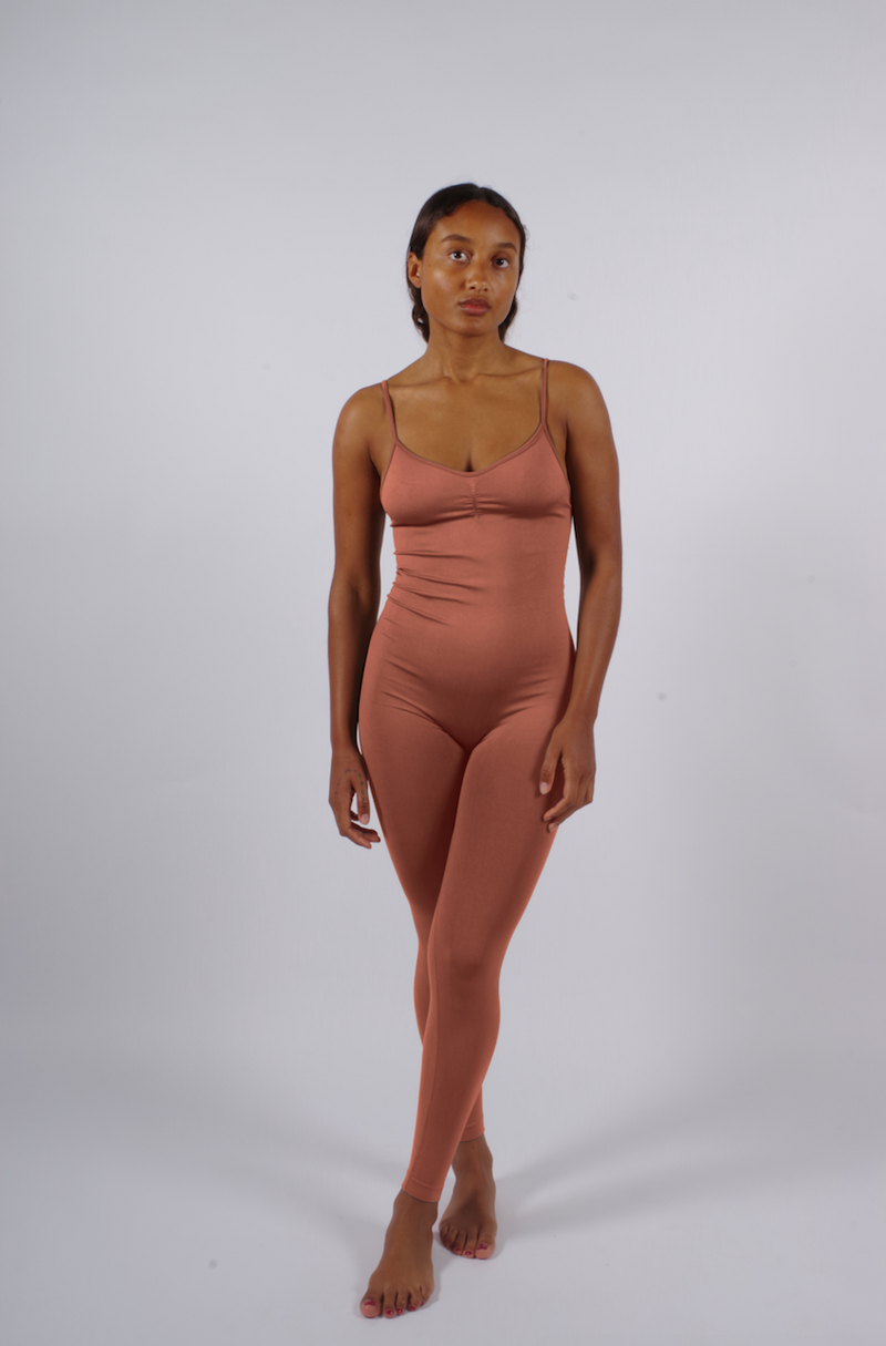 model wears BALANCED - Rusty Pink - PRISM² - compression unitard - supportive playsuit -Workout unitard -  Unitard bodysuit -  Full body compression suit -  Unitard gym wear