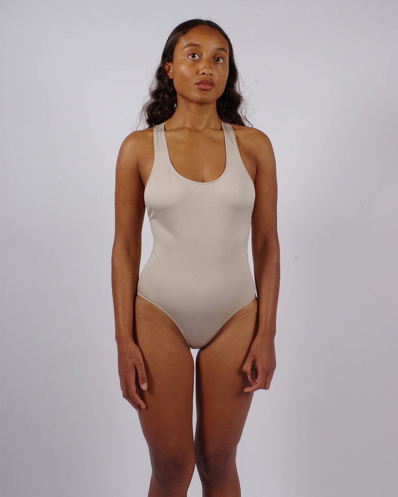 Model wears Zealous | One-Piece swimsuit | Taupe | shaping swimwear | control swimwear | Tummy Control Bathing Suit | Plus Size Swimwear | swimwear for curvy women | compression wear | PRISM²